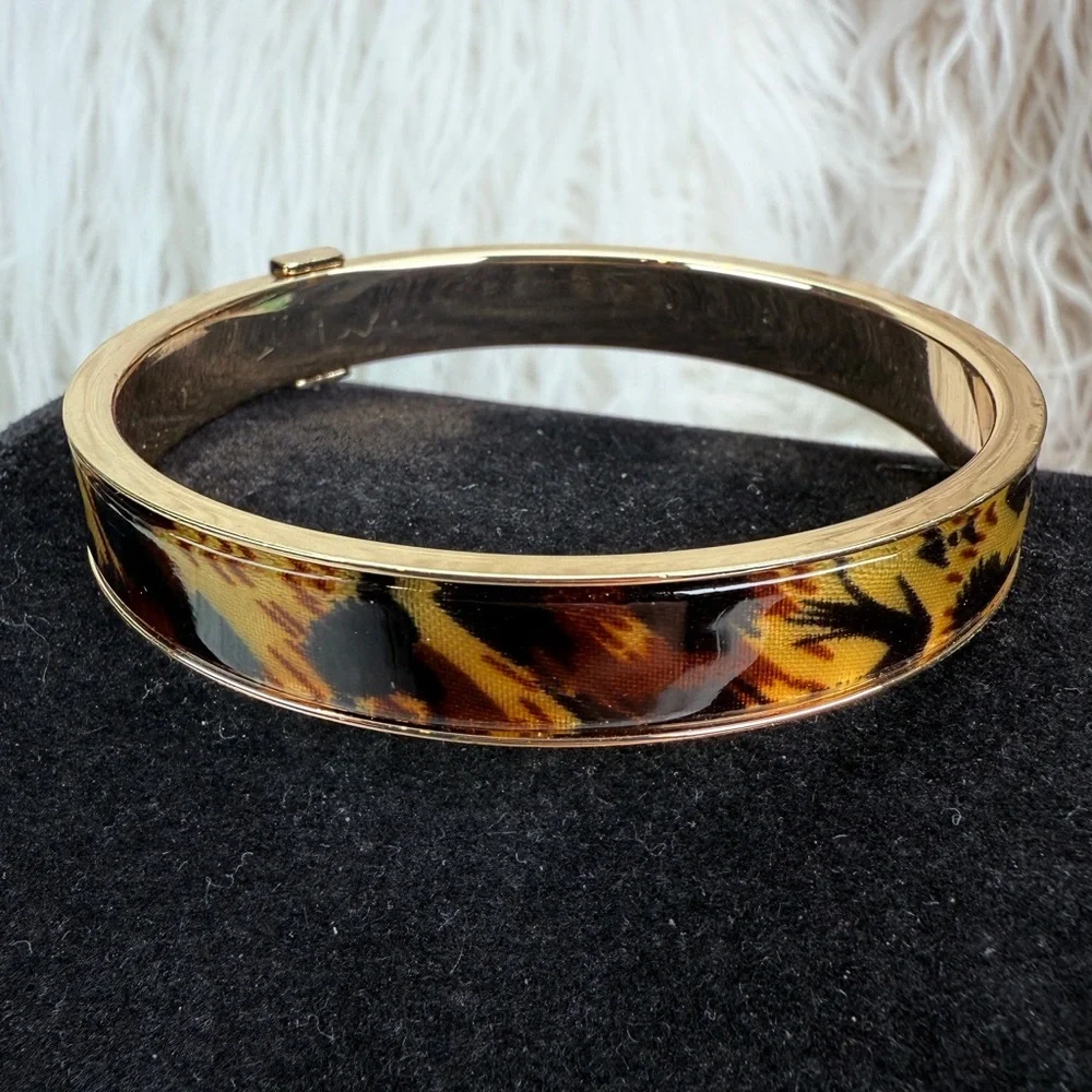 Beautiful, goldtone, animal print nine west bangle bracelet